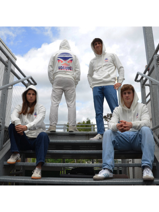 Crèmekleurige HOCQUET hoodie met groot sunset hockeydesign op de rug gedrukt. Crèmekleurige HOCQUET hoodie met groot sunset hockeydesign op de rug gedrukt.