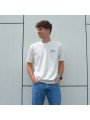 Cremefarbenes Bio-Baumwoll-T-Shirt von HOCQUET mit kleinem Hockeytor-Logo auf der Brust.